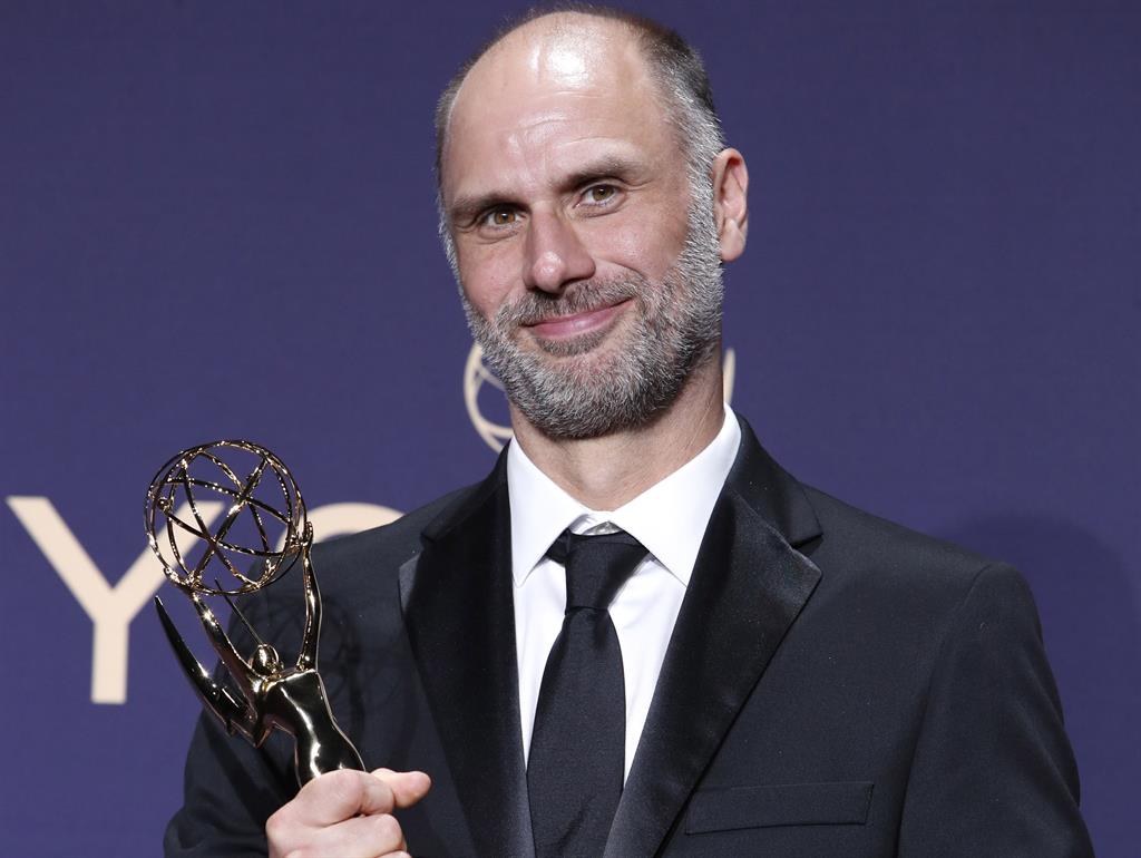 On target: British writer and producer Jesse Armstrong holds the Emmy for outstanding writing for a drama series for Succession