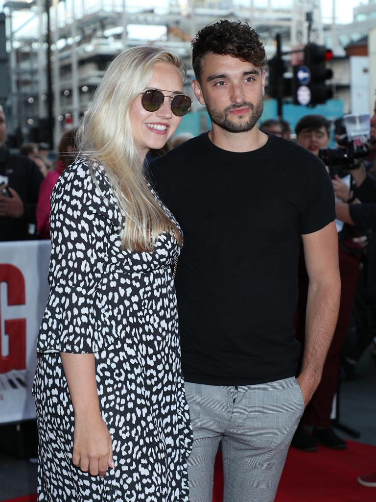 Devastated: Tom with his wife Kelsey Hardwick PICTURE: PA