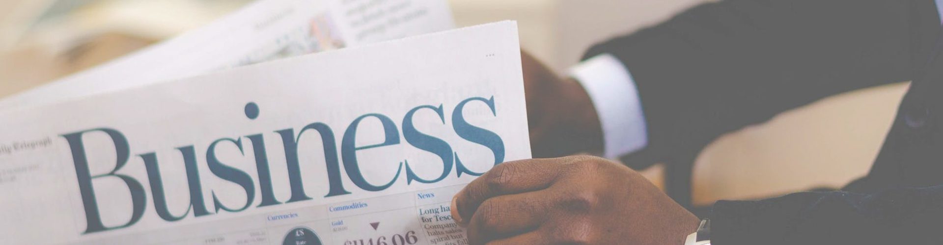 small business security - man reading business newspaper