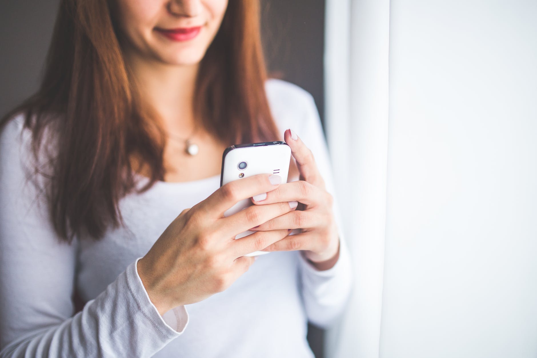 let go of mum guilt - woman on phone