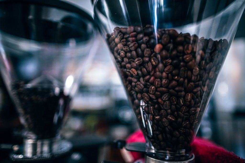 coffee beans inside a good coffee grinder