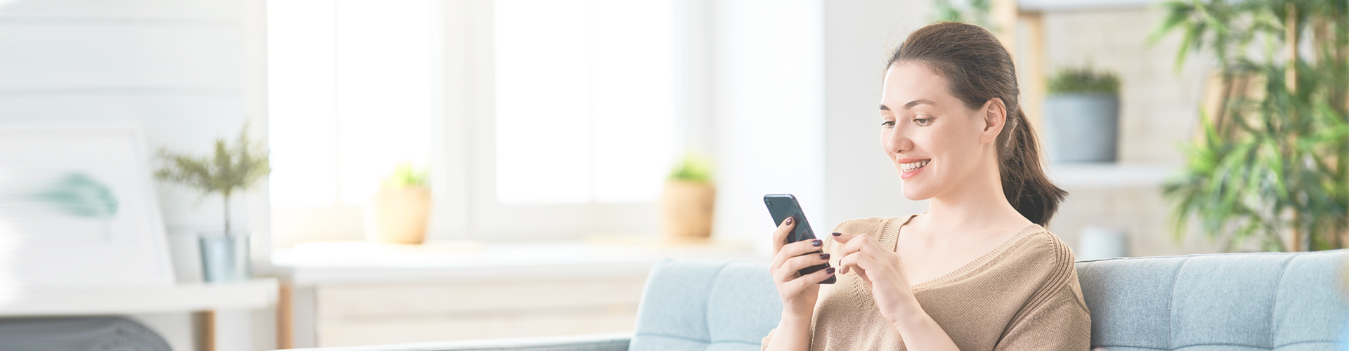 Finding Online Dates Locally - woman smiling, texting on smartphone