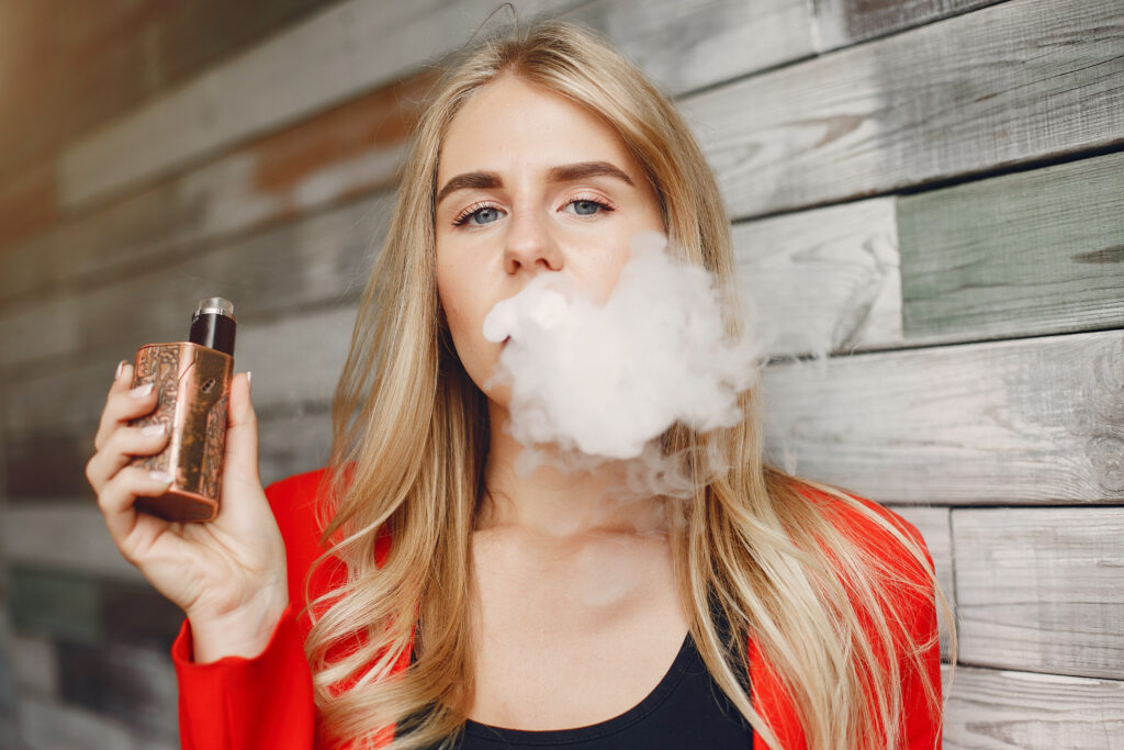 Woman vaping - help you to quit smoking