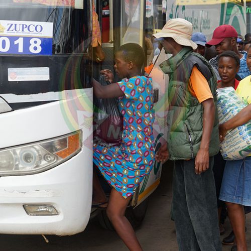 Commuters ride on bus roofs as fuel price hike bites