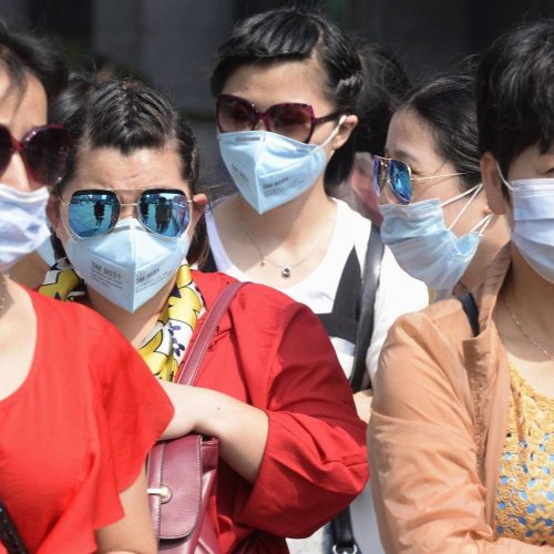 China virus cases pass 70,000 as WHO mission begins