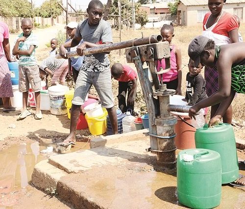 Social distancing remains challenge as residents scramble for borehole water