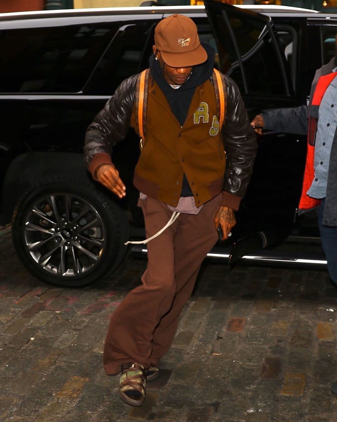 Spotted Travis Scott Goes Mud Brown In Raf Simons Jacket Pause