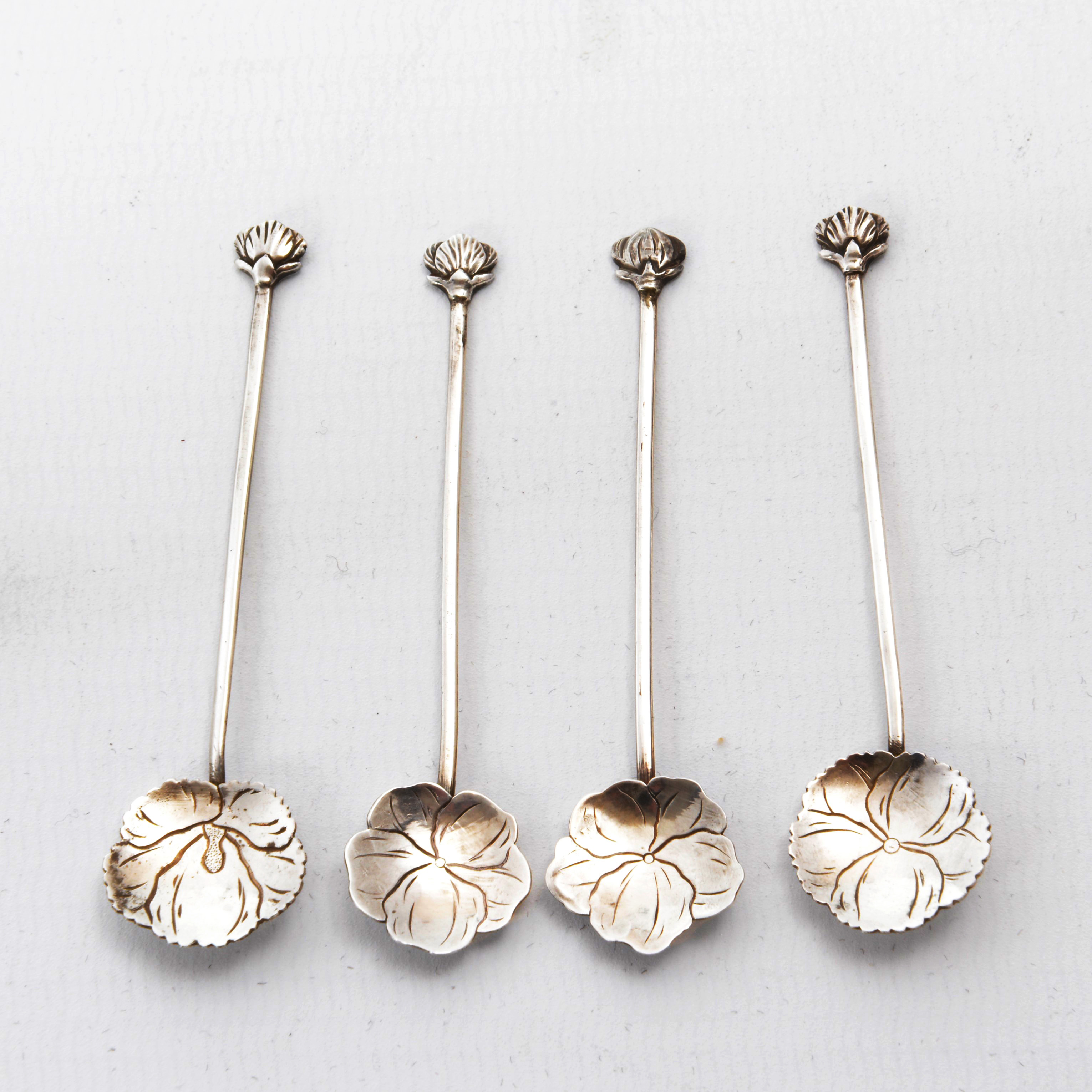 An early set of four Liberty silver Japanese salts and spoons The