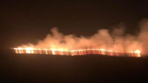 Massive fire pictured tearing through moorland just outside Manchester