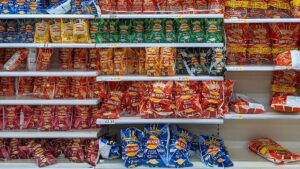 Walkers explains why its cheese and onion crisp packets are blue and not green