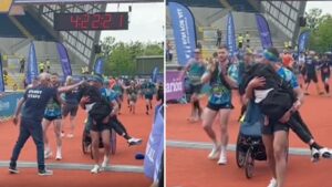 Kevin Sinfield carries friend Rob Burrow over finish line of Leeds marathon
