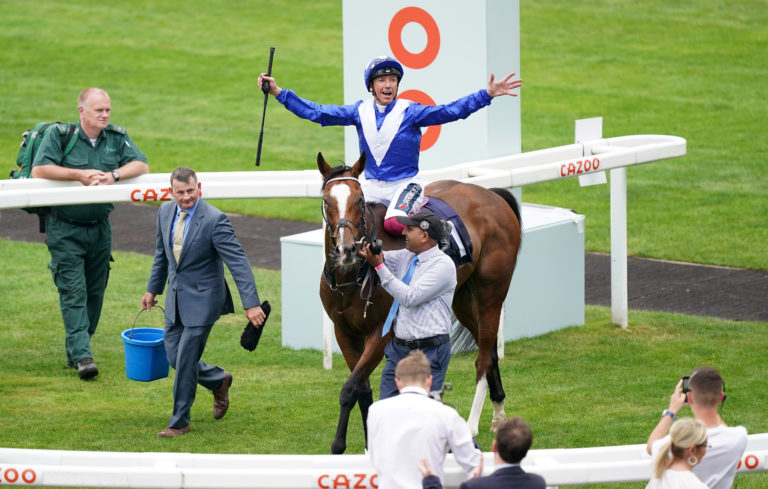 Frankie Dettori leaps from Harrovian after winning The Hilton Garden Inn Doncaster Conditions Stakes