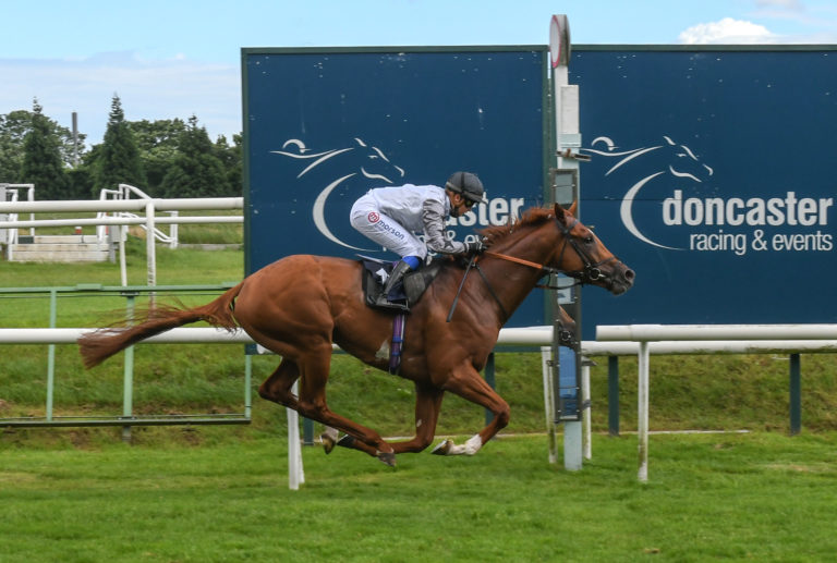 Tyson Fury running on the turf at Doncaster
