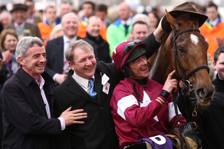 Davy Russell (right) celebrates winning the RSA Chase on Weapon's Amnesty with trainer Charles Byrnes (centre)