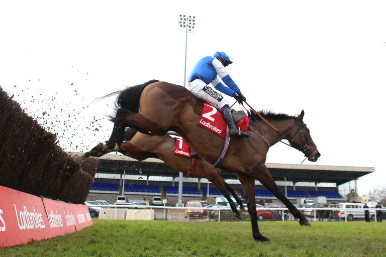 Boothill ridden by jockey J J Burke on their way to winning the Ladbrokes Wayward Lad Novices' Chase during day two of the Ladbrokes Christmas Festival at Kempton Racecourse