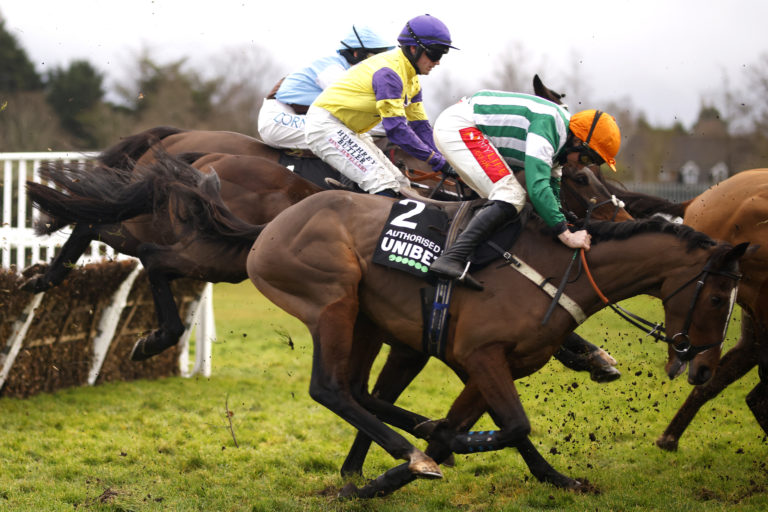 Authorised Speed ridden by jockey Jamie Moore almost falling to the ground but successfully staying on their feet in the Unibet Tolworth Novices' Hurdle at Sandown Park