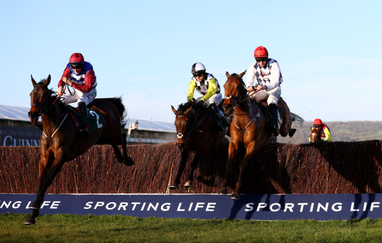 Escaria Ten (left), jumps the last in the Sam Vestey National Hunt Challenge Cup Novices' Chase (Grade 2) during day one of the Cheltenham Festival in 2021