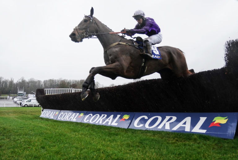 Fugitif ridden by Gavin Sheehan clears a fence before going on to win the Coral Get Closer To The Action Handicap Chase on Coral Welsh Grand National day at Chepstow