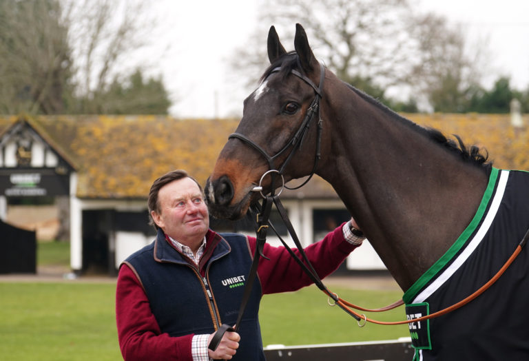 Trainer Nicky Henderson and Shishkin during a visit to Nicky Henderson's stables at Seven Barrows in Lambourn