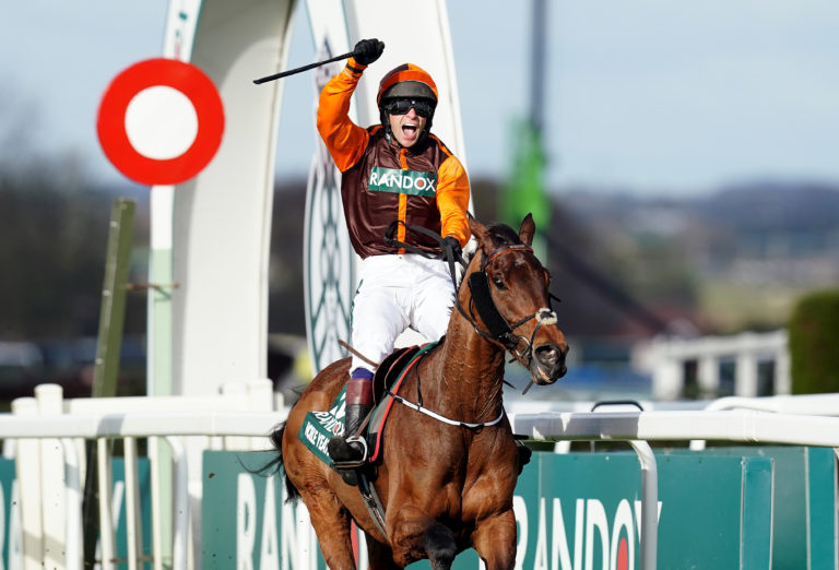 Jockey Sam Waley-Cohen celebrates winning the Randox Grand National on Noble Yeats