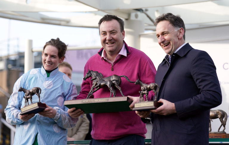 Kenny Alexander flanked by Rachael Blackmore and Henry de Bromhead on the winner's rostrum