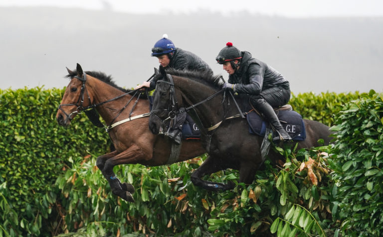 Keith Donoghue on Delta Work (right) on the gallops ahead of the 2023 Cheltenham Festival, which begins tomorrow at Cheltenham Racecourse