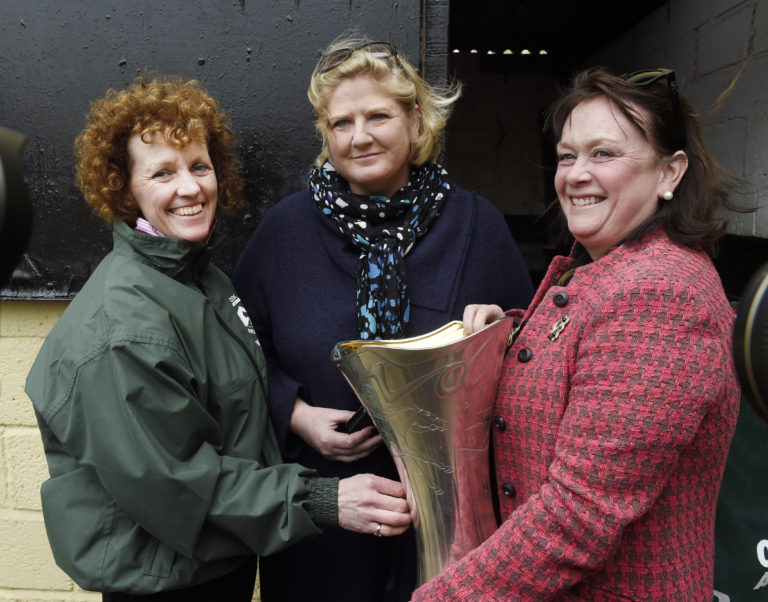 One For Arthur's owners Belinda McClung (centre) and Deborah Thomson with trainer Lucinda Russell (left) with the trophy