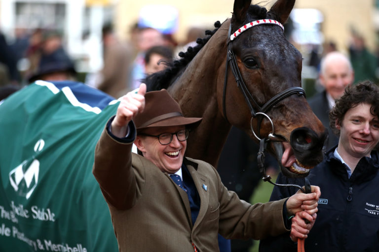 Trainer Harry Whittington celebrates after Simply The Betts wins the Brown Advisory & Merriebelle Stable Plate Handicap Chase at the Cheltenham Festival