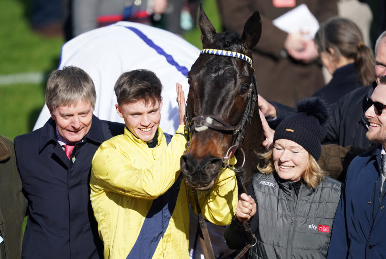 Michael O'Sullivan celebrates winning the Sky Bet Supreme Novices' Hurdle with Marine Nationale, alongside owner and trainer Barry Connell (left) on day one of the Cheltenham Festival