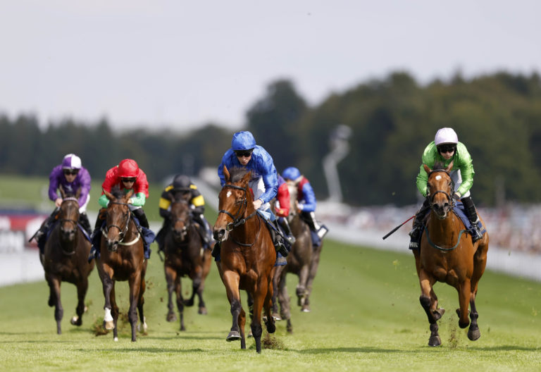 Fairy Cross (centre) ridden by jockey William Buick on their way to winning the William Hill Prestige Fillies' Stakes at Goodwood