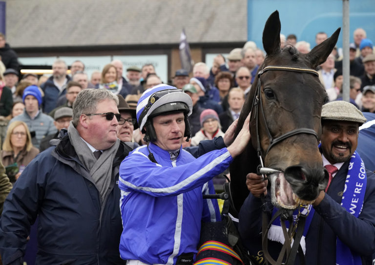 Paul Townend celebrates winning the William Hill Champion Chase with Energumene