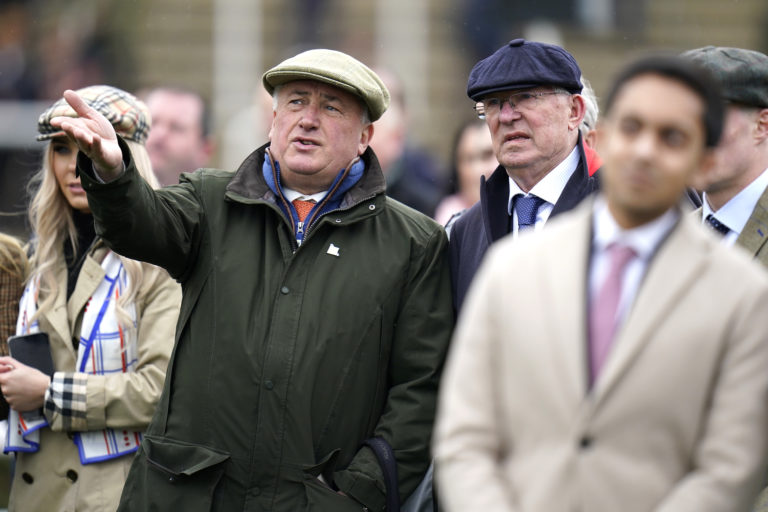 Sir Alex Ferguson (right) and Paul Nicholls watch the Ballymore Novices' Hurdle at the Cheltenham Festival