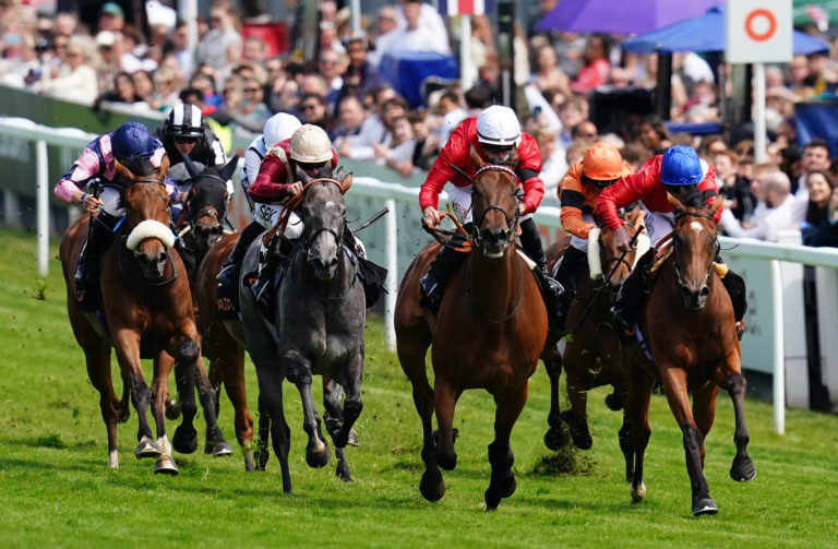 Potapova (right) finishing second at Epsom last summer