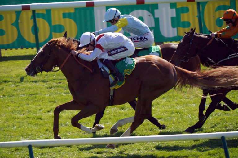 Canberra Legend ridden by jockey Daniel Muscutt on their way to winning the bet365 Feilden Stakes at Newmarket