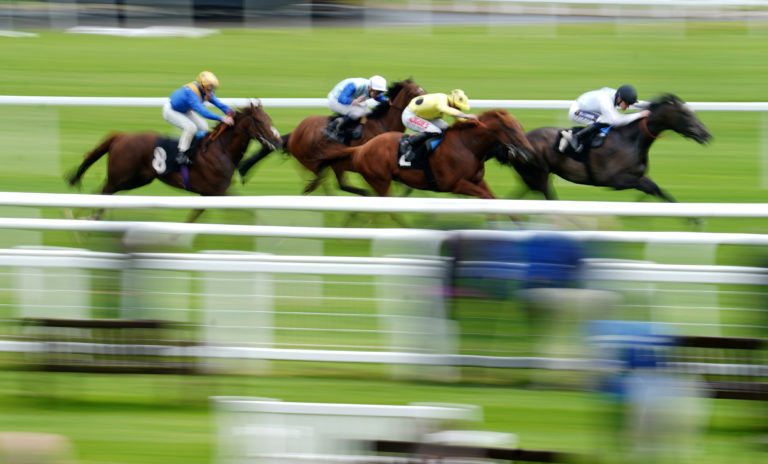Good Karma ridden by Daniel Muscutt (right) wins the Earl & The Pharaoh Novice Stakes at Newbury