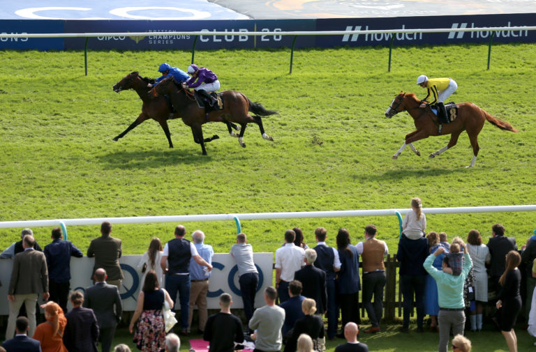 On Point and William Buick (left) coming home to win the Howden British EBF Maiden Stakes at Newmarket