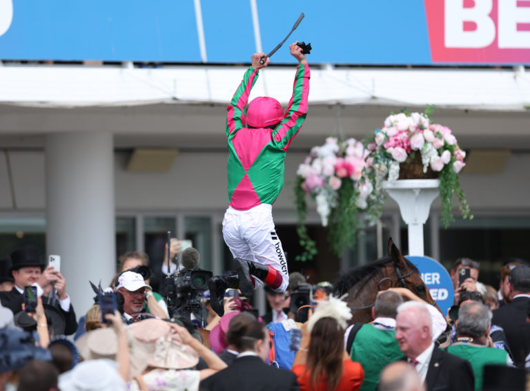 Frankie Dettori performs a flying dismount from Prosperous Voyage