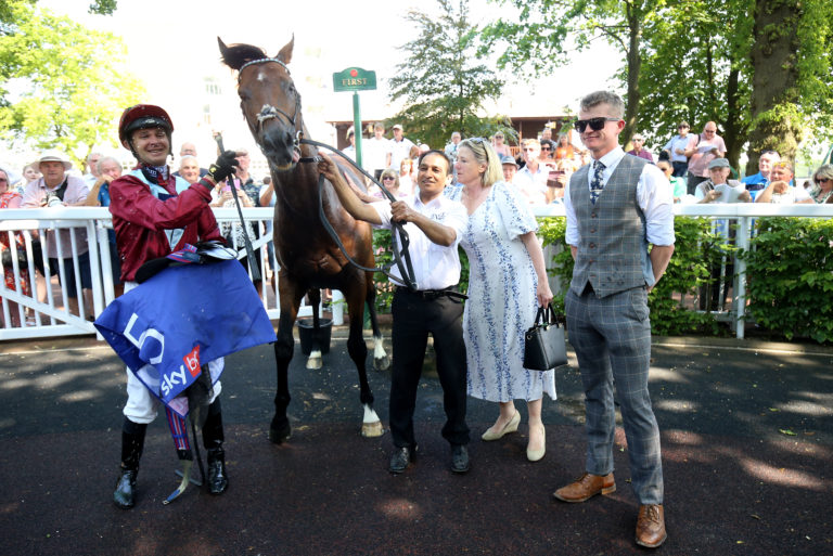 Jumby and team in the winner's enclosure