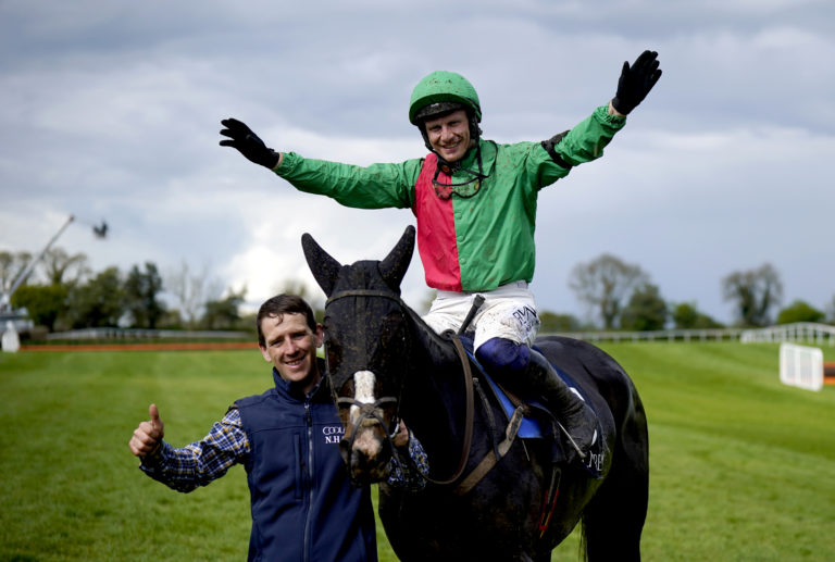 Jockey Paul Townend celebrates on Echoes In Rain after winning at the Punchestown Festival