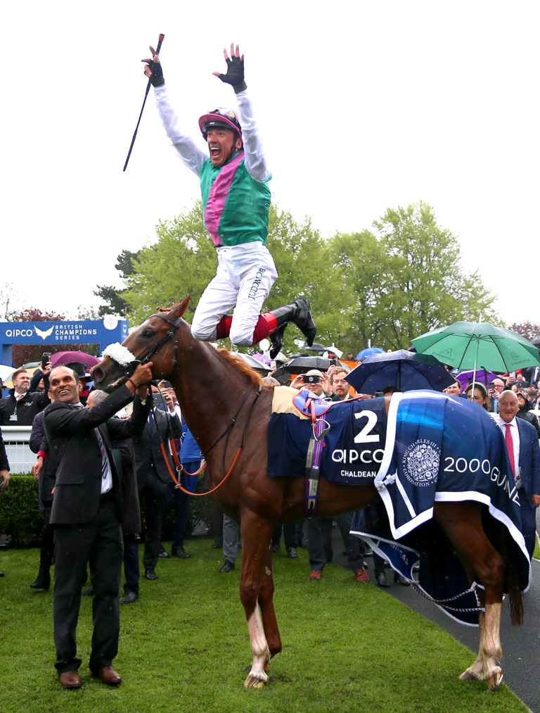 Jockey Frankie Dettori jumps off of Chaldean as he celebrates winning the 2000 Guineas