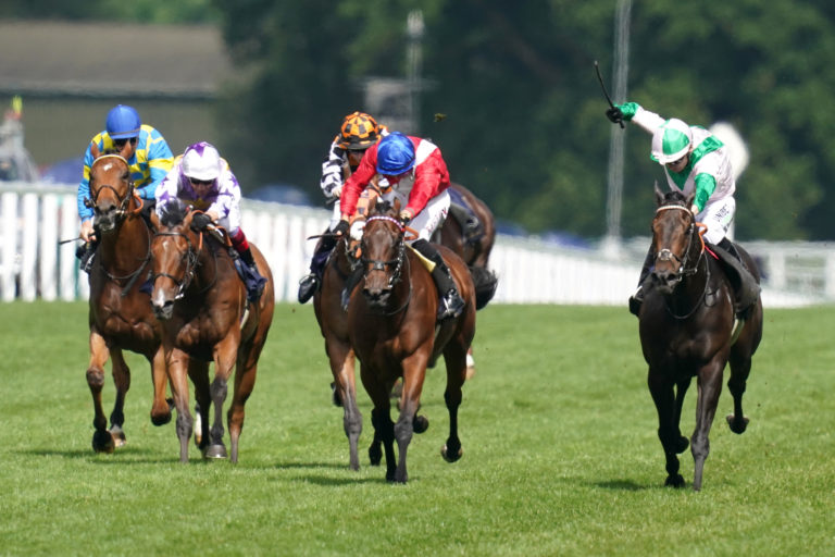 Sacred (centre) was beaten by the flying finish of Khaadem (right) in the Queen Elizabeth II Jubilee Stakes