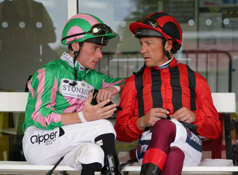 Kieran Shoemark (left) chats to Frankie Dettori (right), the jockey he has replaced on Soul Sister