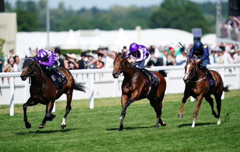 Shaquille (left) sweeps by Little Big Bear at Ascot