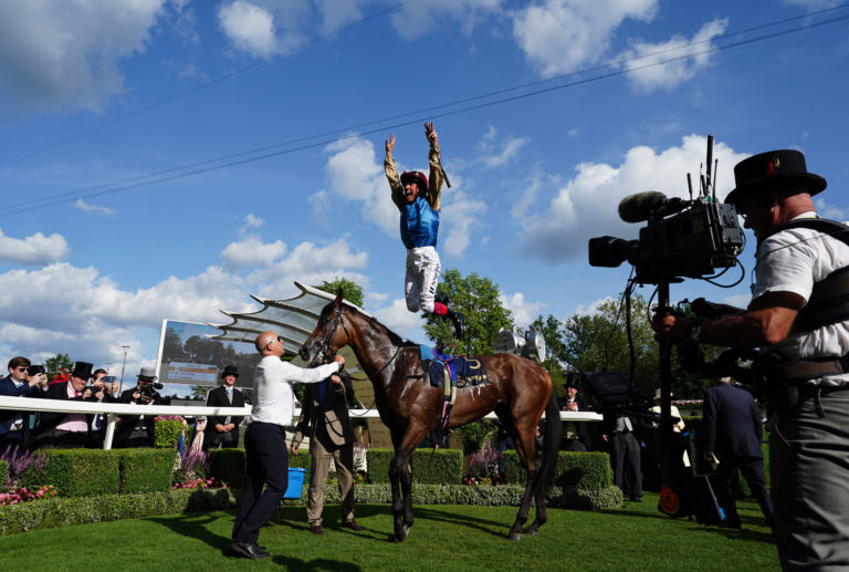 Frankie Dettori leaps from Gregory in the Royal Ascot winner's enclosure