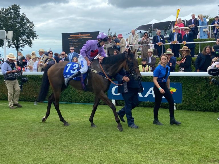 Luke Morris gives Temporize a pat after victory at Goodwood