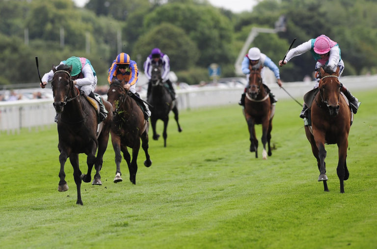 Twice Over (left) denies stablemate Midday in the Juddmonte International