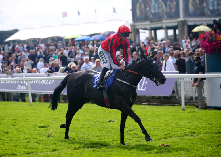 Paul Hanagan crosses the finish line on Wootton'Sun