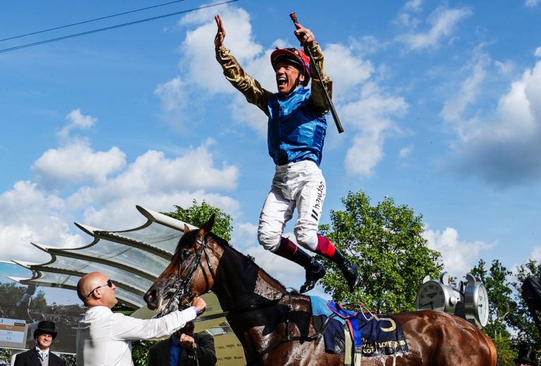 Frankie Dettori leaps from Gregory in the Ascot winner's enclosure