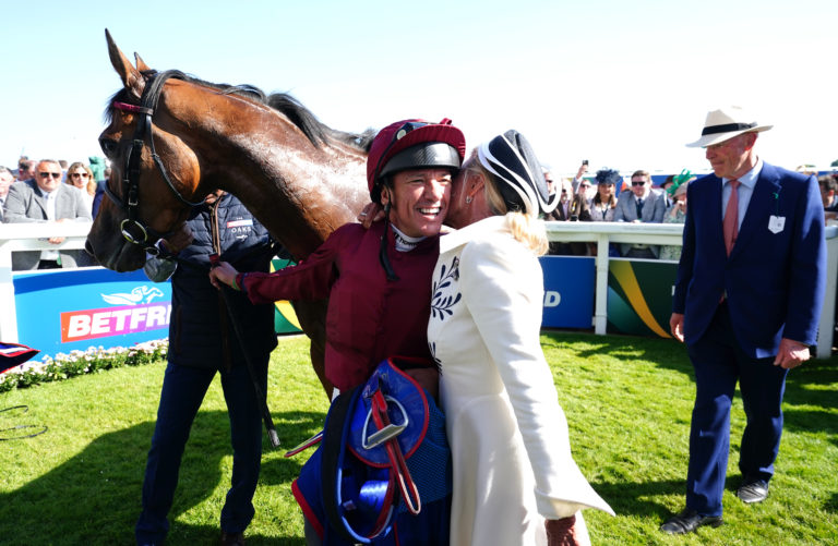 Jockey Frankie Dettori celebrates with Soul Sister's owner Lady Bamford at Epsom
