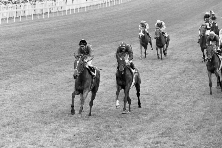 Dunfermline (left), ridden by Willie Carson, winning the Oaks at Epsom